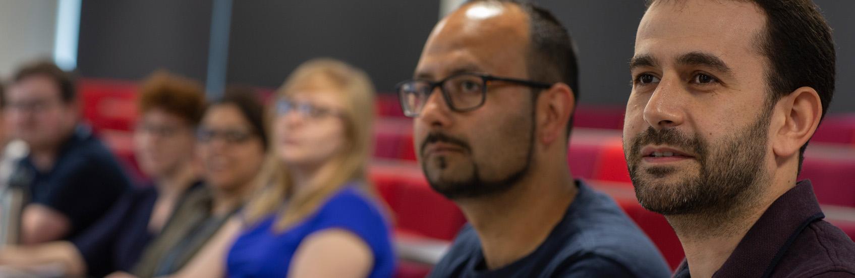 People listening to lecture in seminar room